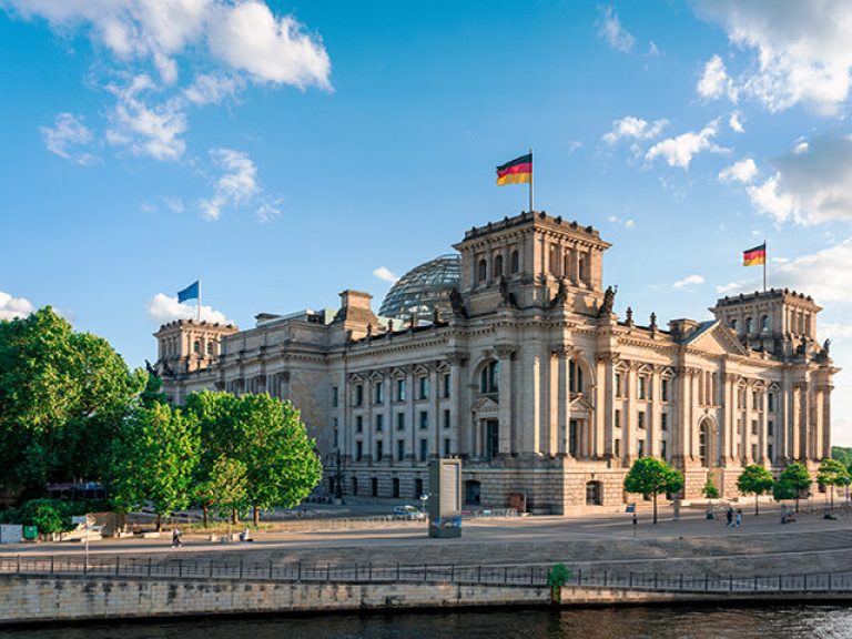 Reichstag with german flag, Berlin, Germany