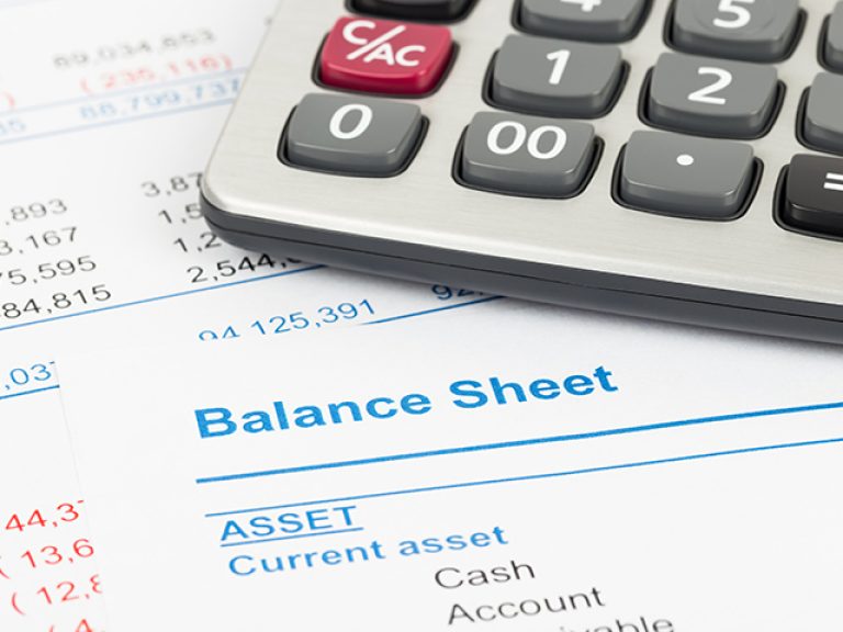 Balance sheet report with calculator; document is mock-up
